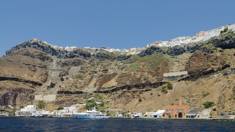 Fira seen from the caldera, Santorini, showing the dense cliff-edge building stock and the stepped access that shapes every job here