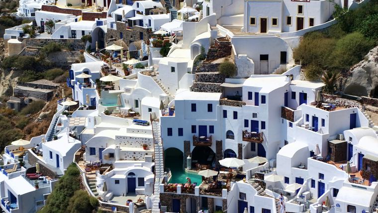 The traditional village of Oia on Santorini, built into the caldera cliff with no vehicle access to most properties